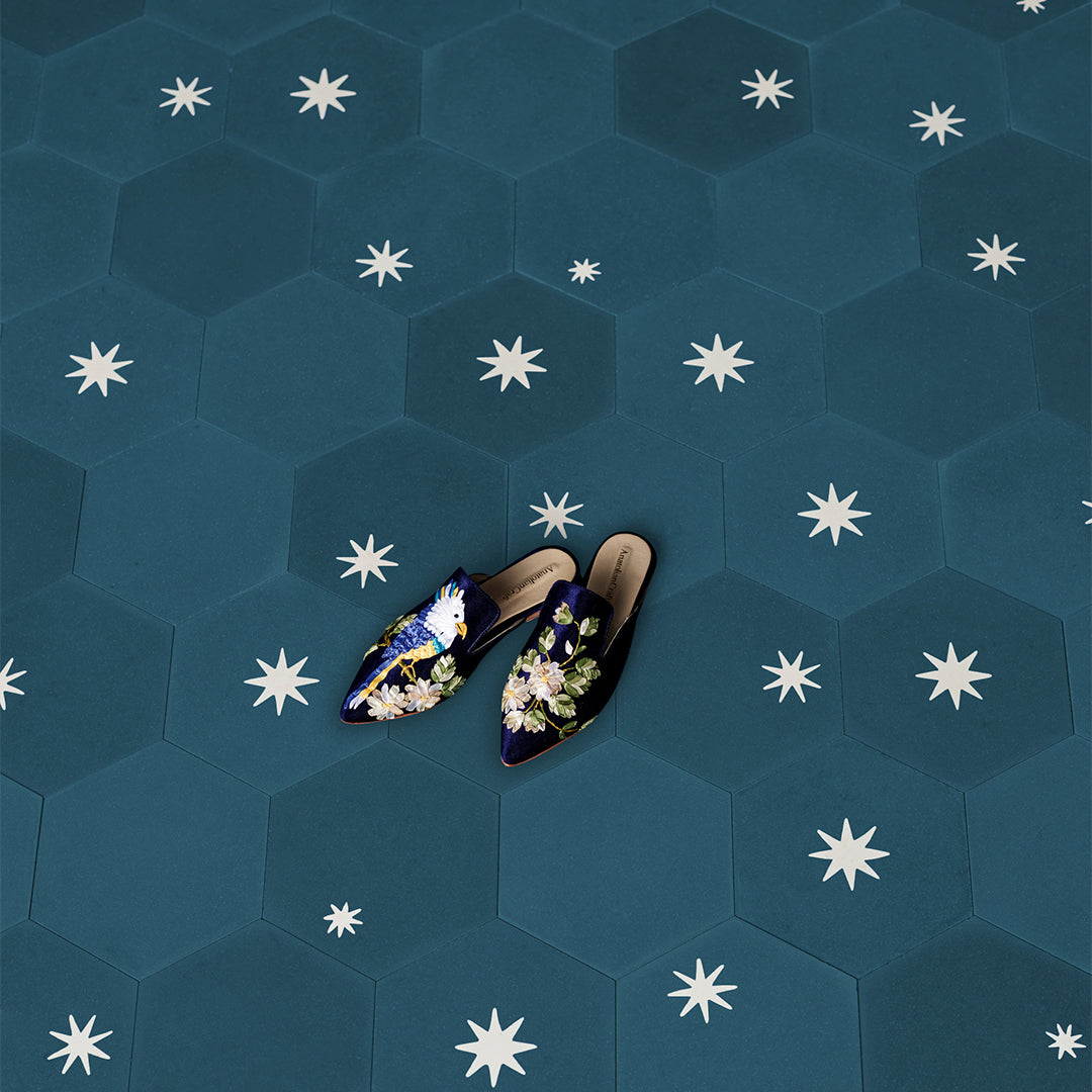 Decorative cement tile design featuring three teal hexagonal tiles with white starburst motifs, arranged in triangular formation, ideal for modern interiors and architectural accents