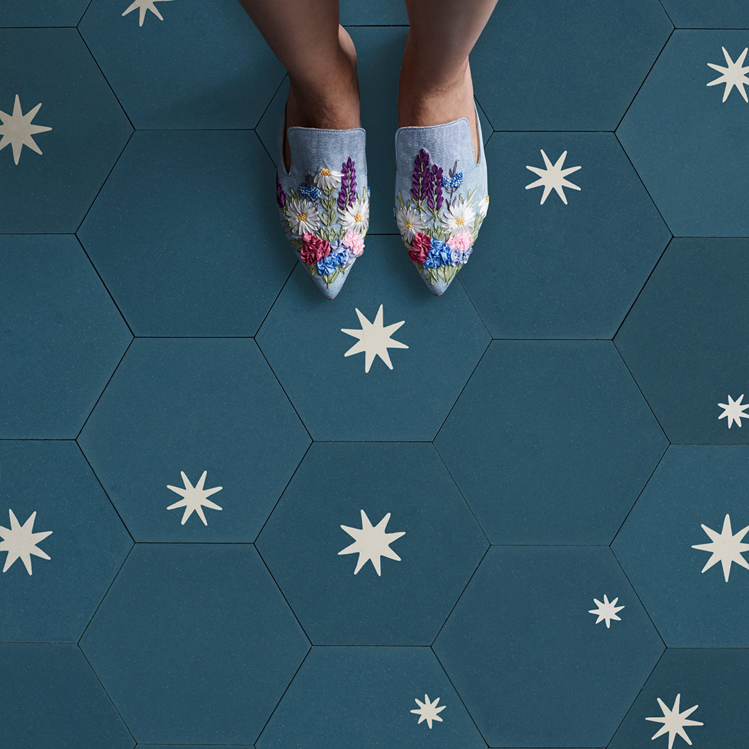 Decorative cement tile design featuring three teal hexagonal tiles with white starburst motifs, arranged in triangular formation, ideal for modern interiors and architectural accents