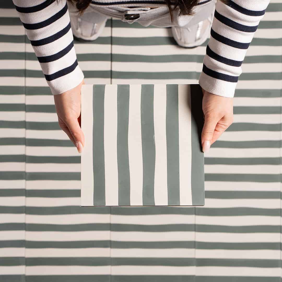 Square green metro cement tile featuring alternating vertical navy blue and white stripes with a matte finish, ideal for modern flooring, wall cladding, and contemporary interior design applications.