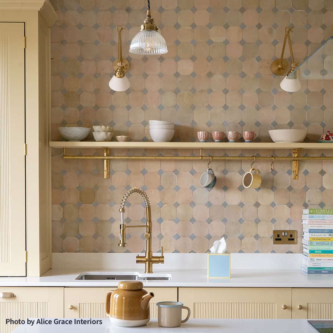 Beautiful tile backsplash featuring a geometric pattern of light beige and blue accents.