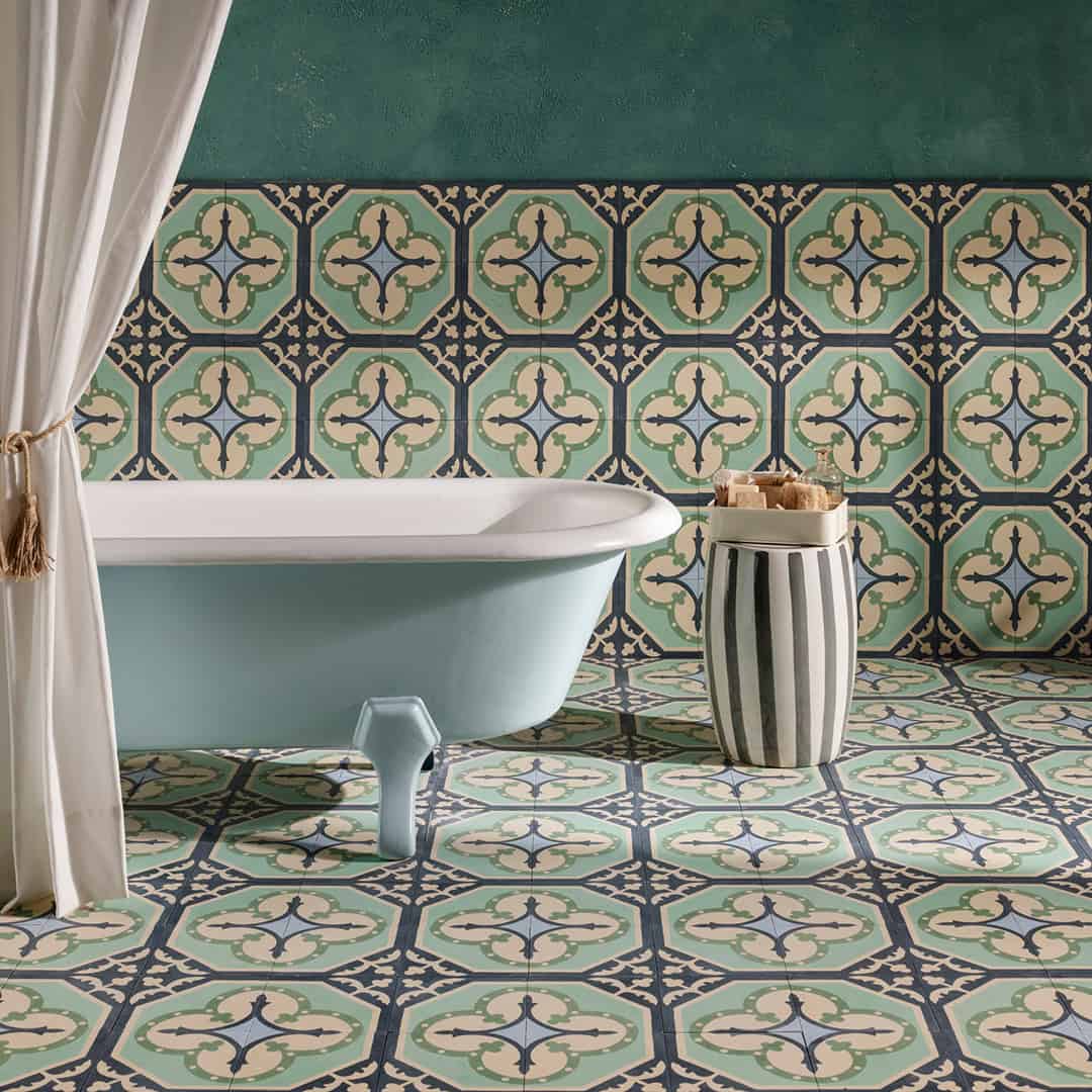 Square blue metro cement tile featuring a vintage floral corner motif in cream, mint green, and navy tones with a matte finish, ideal for Mediterranean flooring, wall décor, and heritage interior design applications.