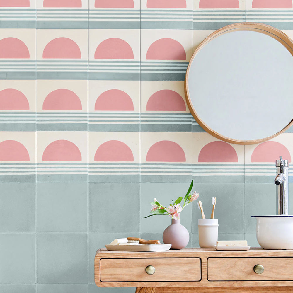 A vibrant display of colorful encaustic tiles arranged in geometric patterns, showcasing Otto Tiles’ artistic craftsmanship and bold design options for modern interiors.
